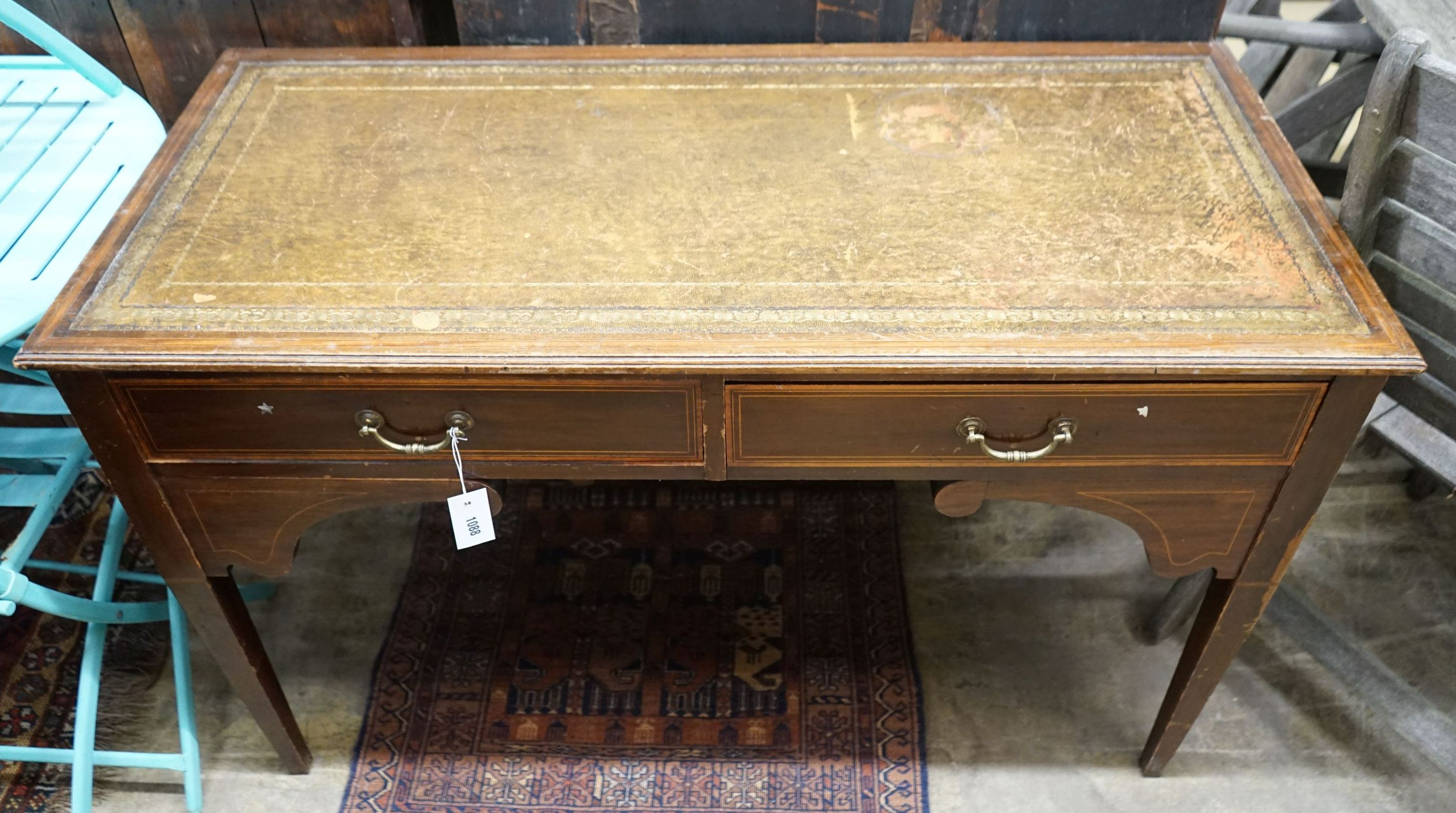 An Edwardian satinwood banded mahogany writing table, width 115cm, depth 53cm, height 72cm